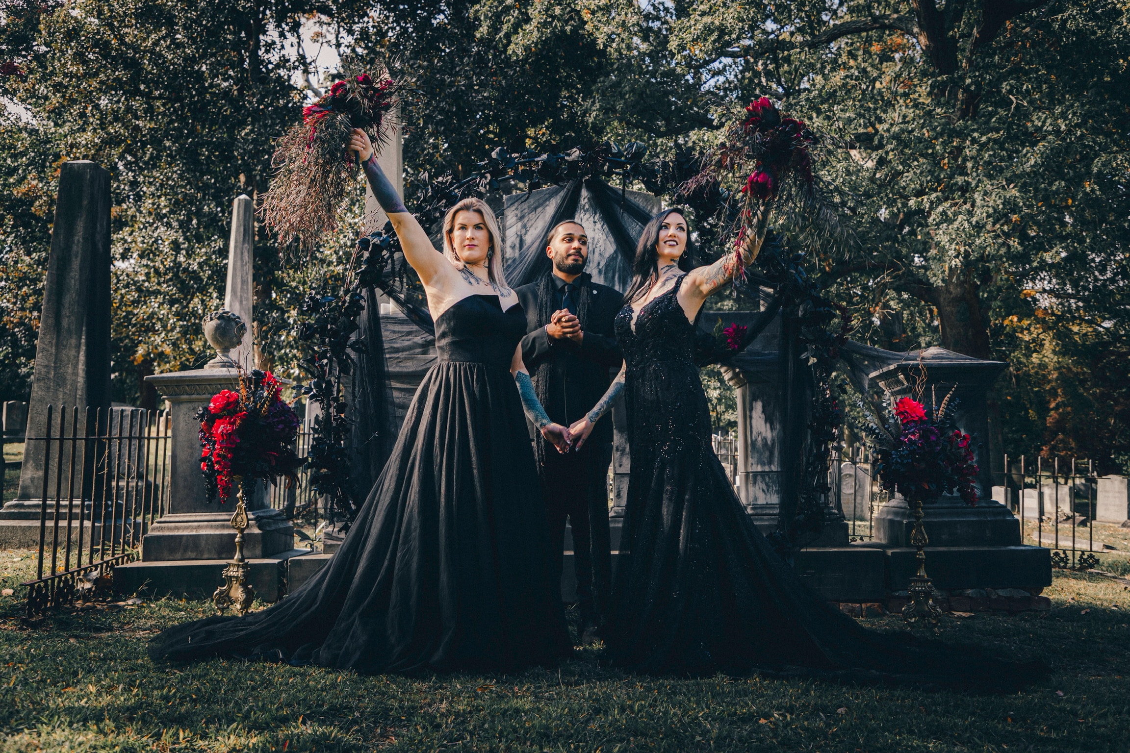 Wedding ceremony at cemetery with dark florals